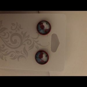 Red floral studs.